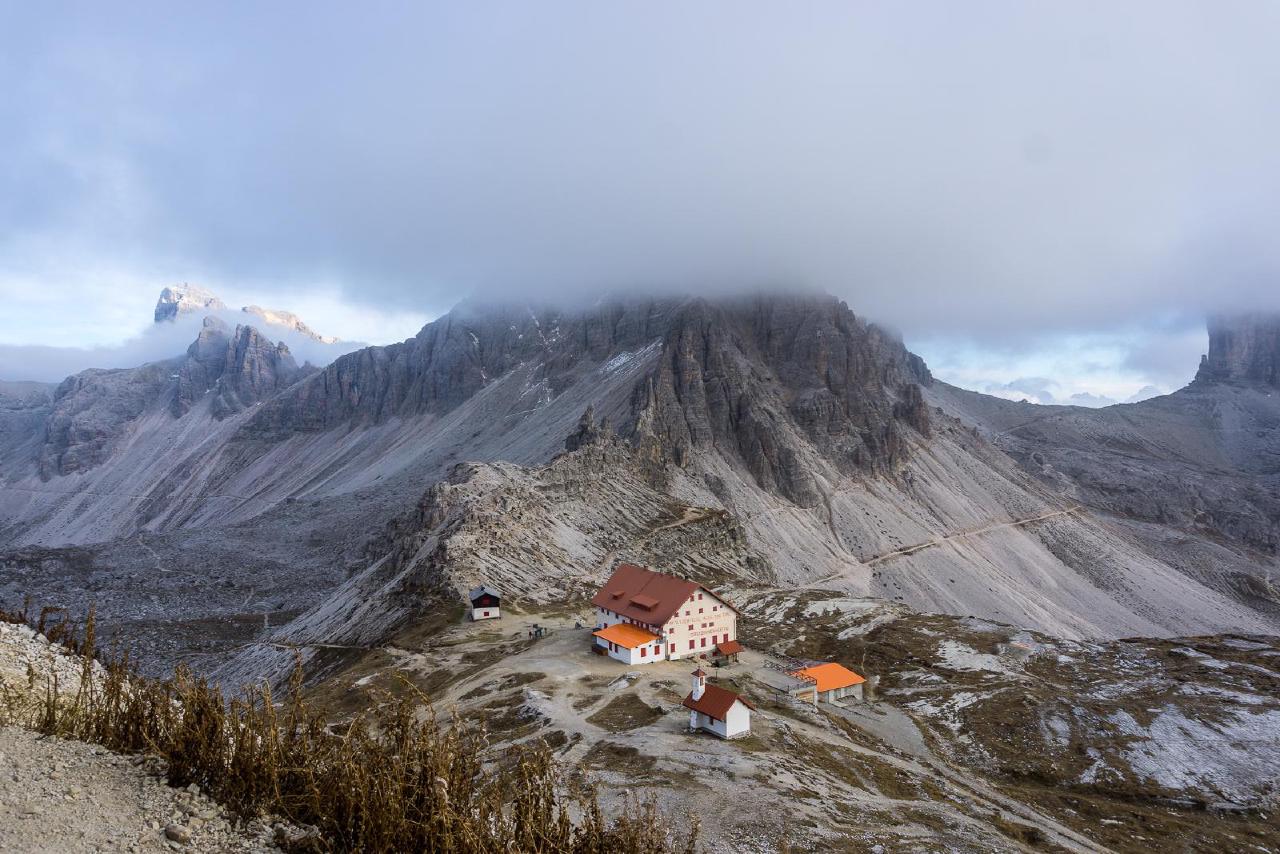 Dreizinnenhutte. If you look closely, you can see a green tent behind it—that's the best camping spot / Dreizinnenhutte, Italy Dreizinnenhutte. If you look closely, you can see a green tent behind it—that's the best camping spot / Dreizinnenhutte, Italy
